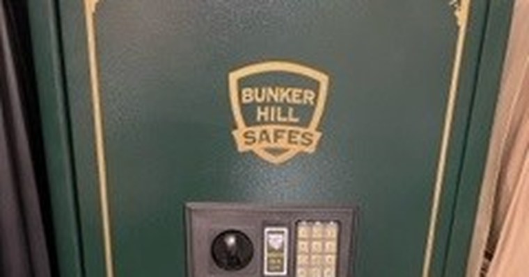 Safe technician servicing a high-security safe lock